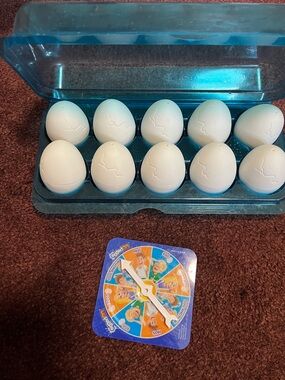 Toy EggedOn Game With Spinner - White Eggs, Teal Case